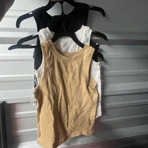 pack of three t shirts colors: black. white. tan. sold separately or as a pack